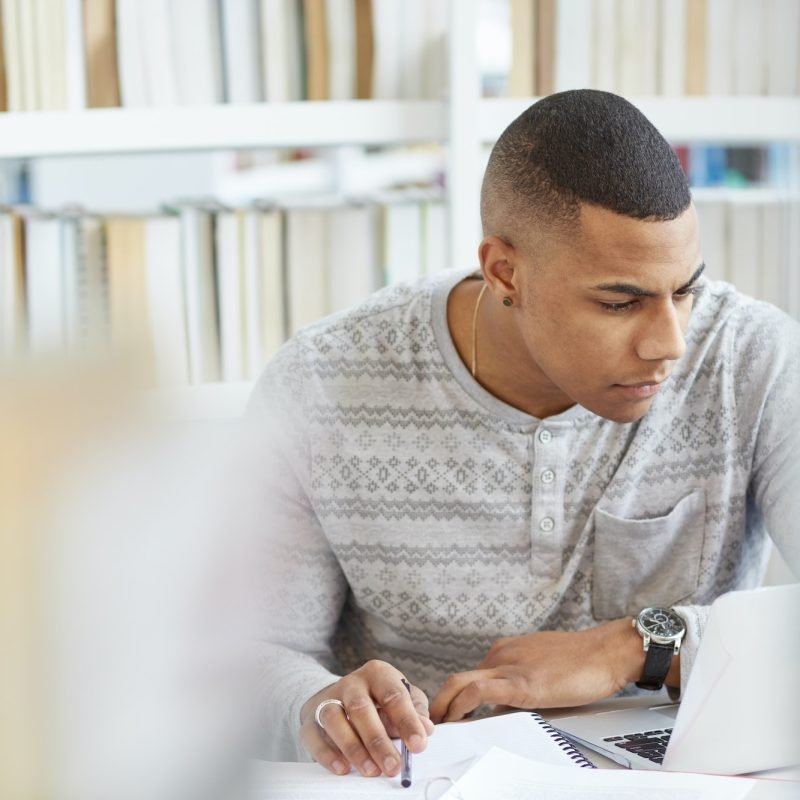 University student working in library